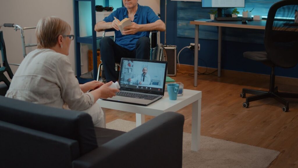 patient talking to doctor in a video call consultation meeting with a specialist in an online conference elderly woman using a laptop to talk to a doctor in a teleconference