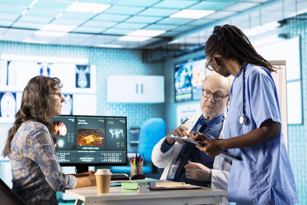 African american nurse assisting senior medic during checkup with old woman